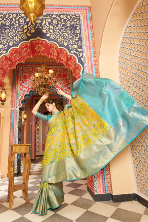 Yellow color soft organza silk saree with woven design