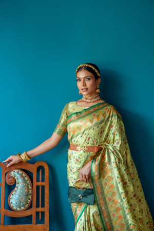 Pista green color patola silk saree with zari weaving work