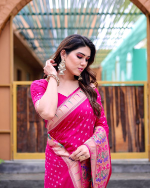Rani pink color bandhej silk saree with zari weaving work