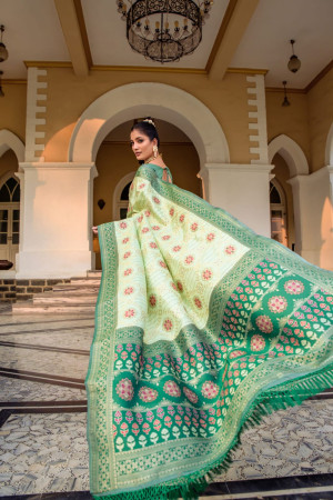Pista green color patola silk saree with zari weaving work