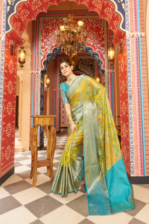 Yellow color soft organza silk saree with woven design