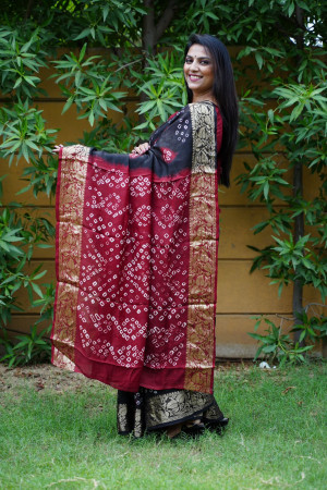 Black color hand bandhej silk saree with bandhani printed work
