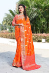 Orange color banarasi soft silk saree with weaving work