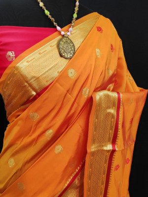 Orange color paithani silk weaving work saree