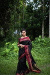 Black color soft raw silk saree with zari woven work