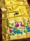 Yellow color paithani silk saree with attractive pallu