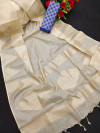 Cream and blue color tissue silk saree with zari weaving temple border