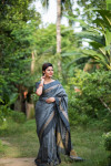 Gray color soft raw silk saree with zari woven work