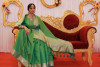Green color soft banarasi silk saree with zari woven border