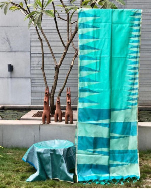 Sea green color pure silk saree with ikat weaving design