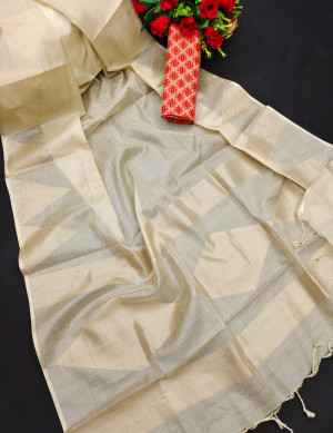 Cream and red color tissue silk saree with zari weaving temple border