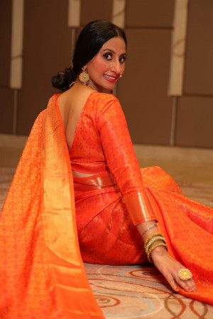 Orange color soft banarasi silk saree with zari woven border