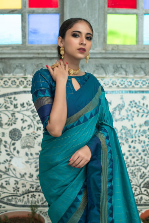 Rama green color soft raw silk saree with zari woven work