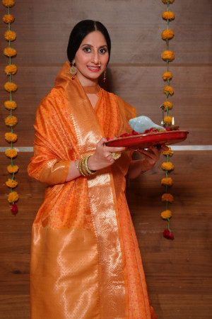 Mustard yellow color soft banarasi silk saree with zari woven border