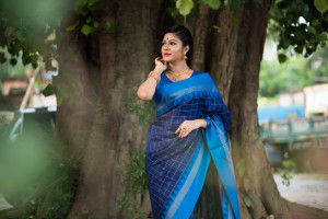 Blue color soft raw silk saree with zari woven work