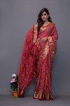 Red art silk saree with hand bandhej print