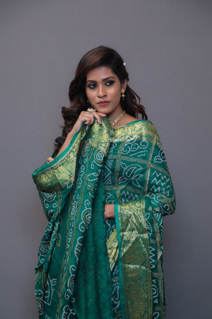 Green art silk saree with hand bandhej print