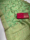 Pista green color dola silk saree with zari weaving work