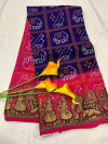 Purple and pink color bandhani silk saree with khadi printed work