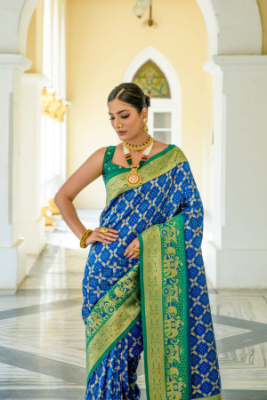 Royal blue color banarasi silk saree with patola design and zari weaving work