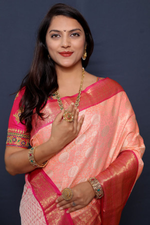 Peach color kanchipuram silk saree with zari woven work