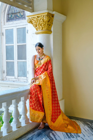 Red color banarasi silk saree with patola design and zari weaving work