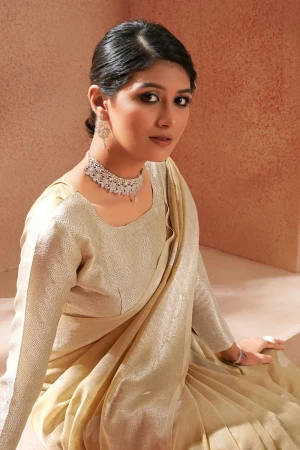 Cream color soft linen silk saree with zari weaving work