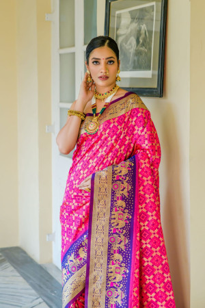 Pink color banarasi silk saree with patola design and zari weaving work