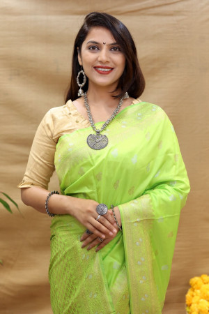 Parrot green color banarasi silk saree with zari weaving work