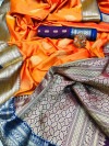 Orange color soft silk saree with contrast zari border and pallu
