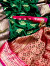 Green color soft silk saree with contrast zari border and pallu