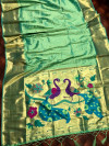 Sea green color paithani silk saree with attractive pallu