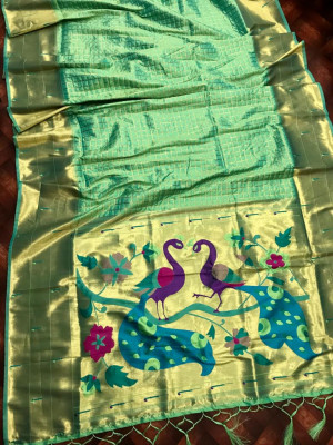 Sea green color paithani silk saree with attractive pallu