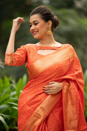Orange color Soft banarasi silk saree with zari woven work