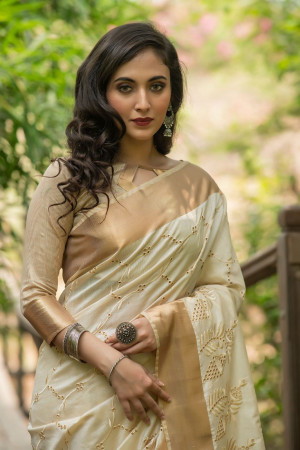 Off white color aasam silk saree with embroidered cut work