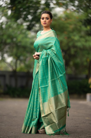 Rama green color Soft banarasi silk saree with zari woven work