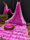 Rani pink and baby pink color bandhani silk saree with hand bandhej work