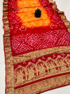 Pink and orange color bandhej silk saree with zari weaving work