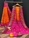 Orange and rani pink color bandhani silk saree with khadi printed work