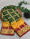 Mahendi green and red color hand bandhej silk saree with zari weaving work