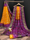 Mustard yellow and purple color bandhani silk saree with khadi printed work