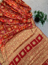 Red hand bandhej silk saree with zari weaving work