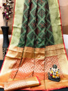 Dark green color patola silk saree with zari weaving work