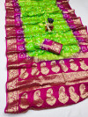 Parrot green and rani pink color hand bandhej silk saree with zari weaving work