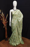 Pista green color soft georgette saree with zari weaving work
