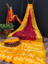 Red and yellow color bandhani silk saree with hand bandhej work