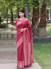Pink color raw silk saree with woven design