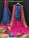 Navy blue and rani pink color bandhani silk saree with khadi printed work