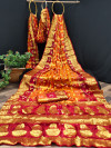 Red and orange color hand bandhej silk saree with zari weaving work