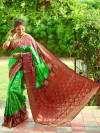 Parrot green and maroon color bandhej silk saree with zari weaving work